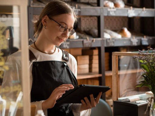 Woman using sales software on tablet